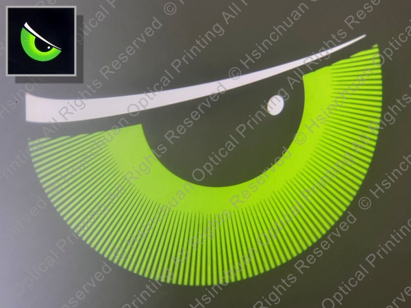 Green eye-shaped projection pattern with bright white highlights for welcome lighting.